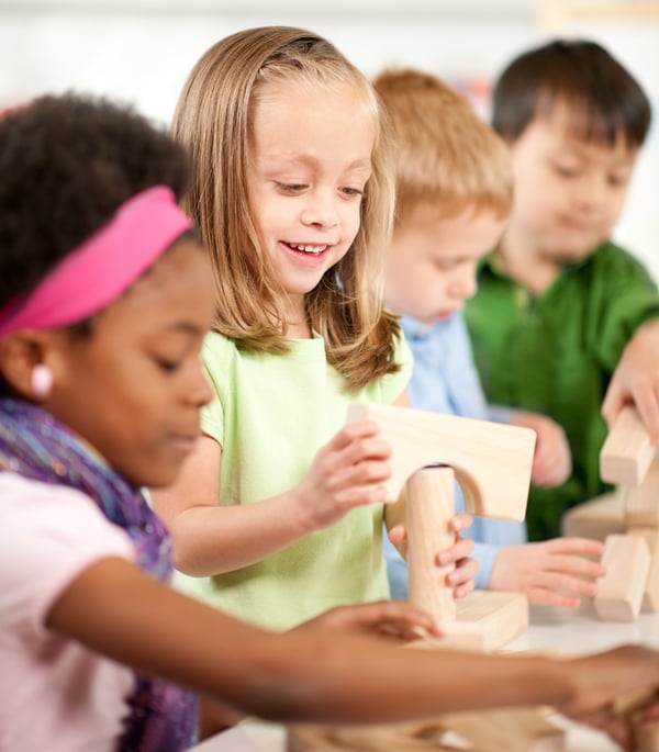 Children playing with blocks in clas